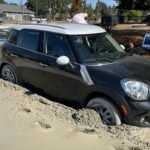 woman-car-wet-concrete-01